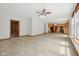 Large living room with tile floors, a view into the kitchen, and lots of open space at 8241 Holmard Pl, Indianapolis, IN 46259