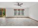 Open living area with tile floor, natural light, and access to the outdoor living space at 8241 Holmard Pl, Indianapolis, IN 46259