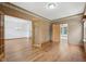 Elegant living room with hardwood floors, French doors, and views into other rooms at 8241 Holmard Pl, Indianapolis, IN 46259