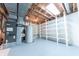 Unfinished basement featuring utilities, shelving, and painted floor at 8772 W Evergreen Dr, Columbus, IN 47201