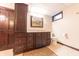 Basement bathroom featuring a vanity with cabinets, a toilet, and modern lighting at 8772 W Evergreen Dr, Columbus, IN 47201