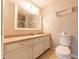 Well-lit bathroom featuring a vanity with ample counter space and storage at 8772 W Evergreen Dr, Columbus, IN 47201