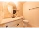 Bathroom featuring a toilet, sink and decorative backsplash at 8772 W Evergreen Dr, Columbus, IN 47201