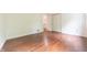Bedroom featuring hardwood floors and large closet at 8772 W Evergreen Dr, Columbus, IN 47201