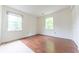 Bright bedroom features hardwood floors and two windows for lots of natural light at 8772 W Evergreen Dr, Columbus, IN 47201