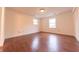 Bedroom featuring hardwood floors and large windows at 8772 W Evergreen Dr, Columbus, IN 47201