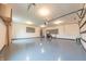 Spacious garage with ample lighting, a workbench and utility sink at 8772 W Evergreen Dr, Columbus, IN 47201