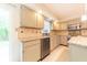 Spacious kitchen with stone countertops, stainless steel appliances, and ample cabinet space at 8772 W Evergreen Dr, Columbus, IN 47201
