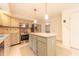 Bright kitchen with stainless steel appliances, an island, and plenty of counter space at 8772 W Evergreen Dr, Columbus, IN 47201