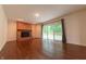 Bright living room featuring hardwood floors and a brick fireplace, a cozy space to unwind at 8772 W Evergreen Dr, Columbus, IN 47201