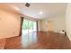 Spacious living room featuring hardwood floors, sliding glass doors, and natural light at 8772 W Evergreen Dr, Columbus, IN 47201