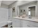 Modern bathroom with double vanity, white cabinets, and a bathtub, designed for comfort and convenience at 8820 Alexander Ridge Dr, McCordsville, IN 46055
