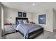 A cozy bedroom showcasing unique decor, including dinosaur-themed artwork and industrial-style nightstands at 8820 Alexander Ridge Dr, McCordsville, IN 46055