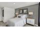 Cozy bedroom featuring soft gray walls, white linens, and minimalist modern decor at 8853 Alexander Ridge Dr, McCordsville, IN 46055