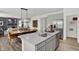 Bright kitchen boasts stainless steel appliances, center island, and adjacent dining area for modern living at 8853 Alexander Ridge Dr, McCordsville, IN 46055