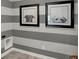 Charming laundry room featuring striped walls with decorative dog prints at 8853 Alexander Ridge Dr, McCordsville, IN 46055
