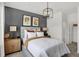 Comfortable bedroom with a padded headboard, modern lighting fixture, and soft neutral color scheme with luxury details at 8853 Alexander Ridge Dr, McCordsville, IN 46055