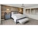 Beautifully designed main bedroom with wood accent wall, stylish lamps, and soft, neutral tones at 8853 Alexander Ridge Dr, McCordsville, IN 46055