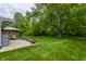 Large backyard with patio, seating, and fire pit at 8905 Washington Blvd West Dr, Indianapolis, IN 46240