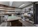Spacious basement area with built-in shelving at 8905 Washington Blvd West Dr, Indianapolis, IN 46240