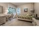Bright bedroom with large windows, a small writing desk and a comfortable bed at 8905 Washington Blvd West Dr, Indianapolis, IN 46240