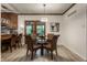 Bright breakfast nook area featuring a glass table with wicker chairs, and view to the exterior at 8905 Washington Blvd West Dr, Indianapolis, IN 46240