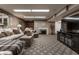 Finished basement featuring a comfortable living room with a fireplace and soft, neutral colors at 8905 Washington Blvd West Dr, Indianapolis, IN 46240