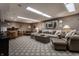 Finished basement with living area, showing recessed lighting and comfortable seating at 8905 Washington Blvd West Dr, Indianapolis, IN 46240