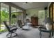 Inviting sunroom with plenty of seating at 8905 Washington Blvd West Dr, Indianapolis, IN 46240