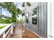 Private balcony with wood decking and modern railing, perfect for enjoying outdoor views at 902 Woodlawn Ave, Indianapolis, IN 46203