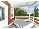 Outdoor balcony with a hammock and a view of trees and the neighborhood at 902 Woodlawn Ave, Indianapolis, IN 46203