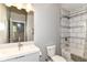 Modern bathroom featuring updated tile, fixtures, and a combined tub and shower at 902 Woodlawn Ave, Indianapolis, IN 46203