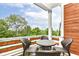 Outdoor deck with a table and four chairs perfect for relaxing and entertaining at 902 Woodlawn Ave, Indianapolis, IN 46203