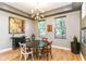 Elegant dining room features hardwood floors, modern lighting, and a stylish table for gatherings at 902 Woodlawn Ave, Indianapolis, IN 46203