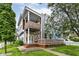 Striking two-story townhouse showcasing modern architecture and well-maintained landscaping at 902 Woodlawn Ave, Indianapolis, IN 46203