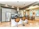 Modern kitchen with stainless steel appliances, sleek countertops, and an island with bar seating at 902 Woodlawn Ave, Indianapolis, IN 46203