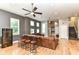 Spacious living room with hardwood floors, a comfortable sofa, and a stylish entertainment center at 902 Woodlawn Ave, Indianapolis, IN 46203