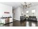 Spacious living room with dark wood floors, modern lighting, and comfortable leather seating at 902 Woodlawn Ave, Indianapolis, IN 46203