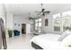 Airy main bedroom featuring white floors, ceiling fan, and great natural light at 902 Woodlawn Ave, Indianapolis, IN 46203