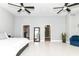Bright main bedroom with walk-in closet, en-suite bathroom, and a seating area at 902 Woodlawn Ave, Indianapolis, IN 46203
