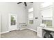Bright office space with lots of natural light, neutral tones, and a door to the outside at 902 Woodlawn Ave, Indianapolis, IN 46203