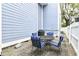 Back patio area featuring outdoor furniture and a grill, perfect for entertaining at 902 Woodlawn Ave, Indianapolis, IN 46203
