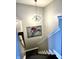 Open staircase with modern lighting fixture and eye-catching artwork at 902 Woodlawn Ave, Indianapolis, IN 46203