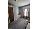 Comfortable bedroom offers plenty of space and natural light from the window at 9507 Colony Pointe E Dr, Indianapolis, IN 46250