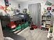 A bedroom with bunk beds, colorful decor, and space for activities at 9507 Colony Pointe E Dr, Indianapolis, IN 46250