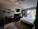 Bedroom boasts ample natural light and sliding glass door for direct backyard access at 9507 Colony Pointe E Dr, Indianapolis, IN 46250