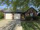 Charming single story brick home with two-car garage and mature landscaping at 9507 Colony Pointe E Dr, Indianapolis, IN 46250
