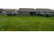Large, grassy backyard enclosed by a black metal fence, perfect for outdoor activities and relaxation at 9741 Haughton Ln, McCordsville, IN 46055