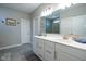 Spacious bathroom featuring double sinks with quartz countertops, modern fixtures, and a large mirror at 9741 Haughton Ln, McCordsville, IN 46055