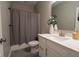 Modern bathroom featuring sleek vanity, white toilet, decorative flower, and brushed nickel faucet at 9741 Haughton Ln, McCordsville, IN 46055